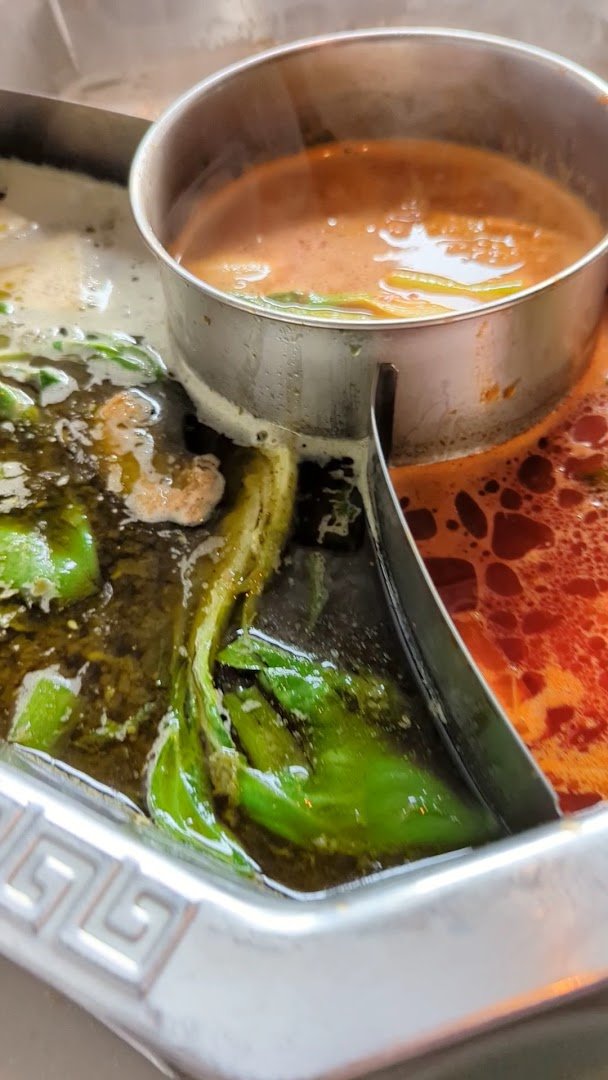 Restaurant table set for hot pot dinner