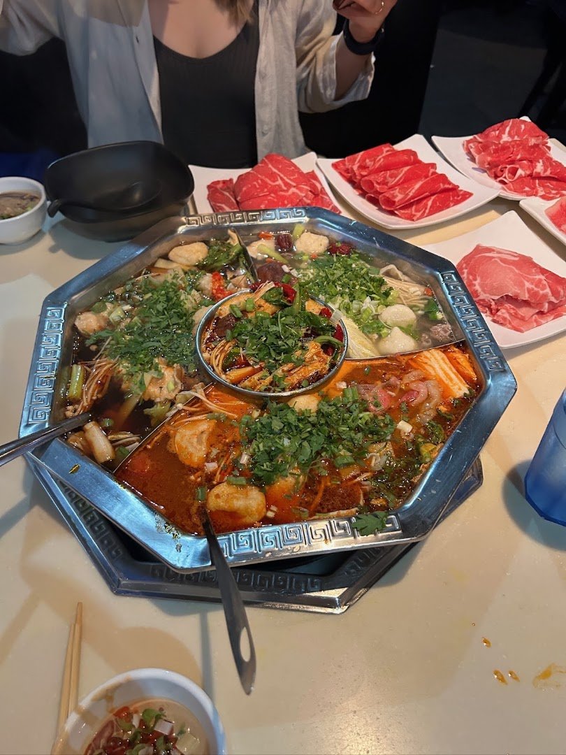 Steaming hot pot bowls on a table